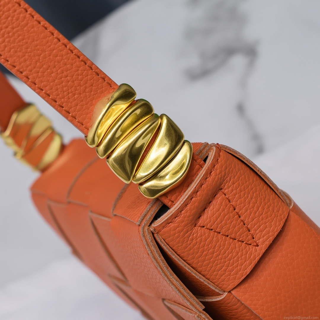 Bottega Veneta BV 666870 Cassette Intreccio grained leather cross-body bag Orange