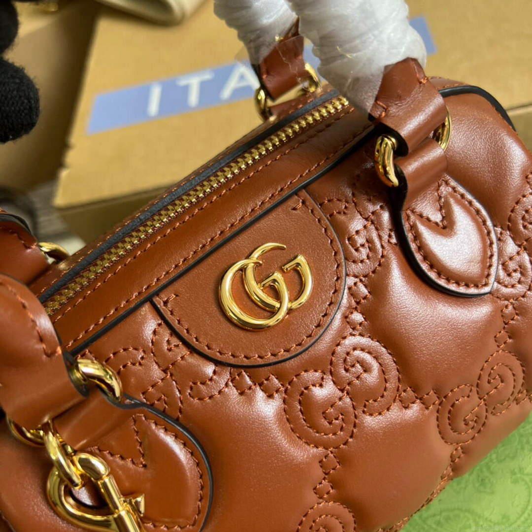 Gucci 702251 GG matelassé leather top handle bag Brown