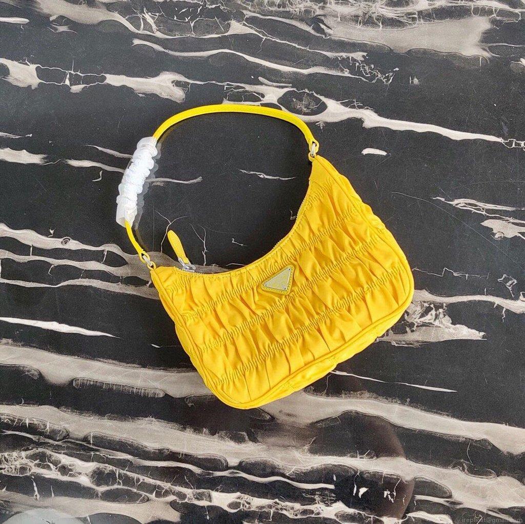 Prada 1NE204 Prada Nylon and Saffiano Leather Mini Bag in Yellow
