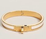 Mini Clic Kelly bracelet Product information Metallic finish Yellow gold plated